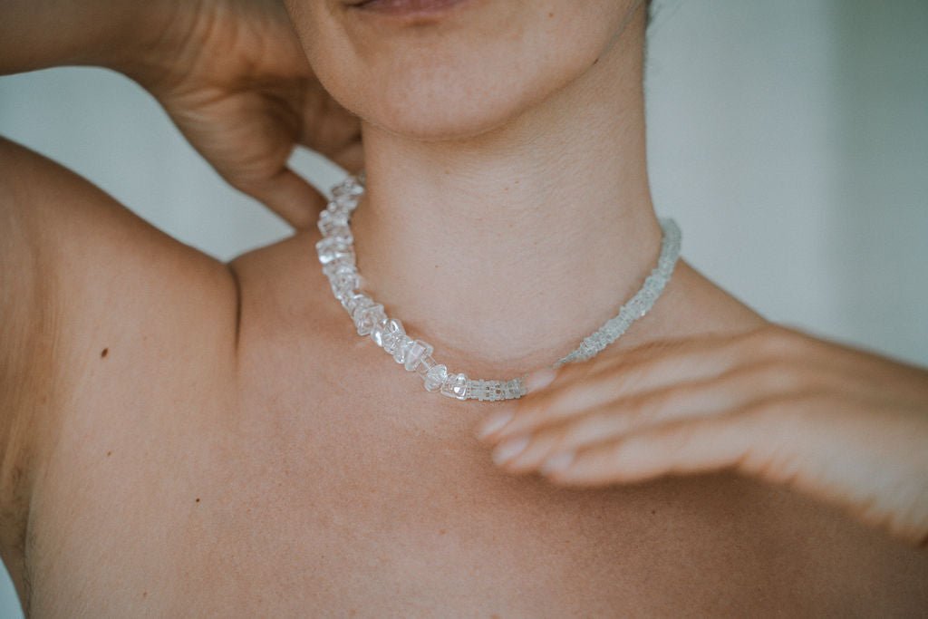 Woman wearing aquamarine necklace