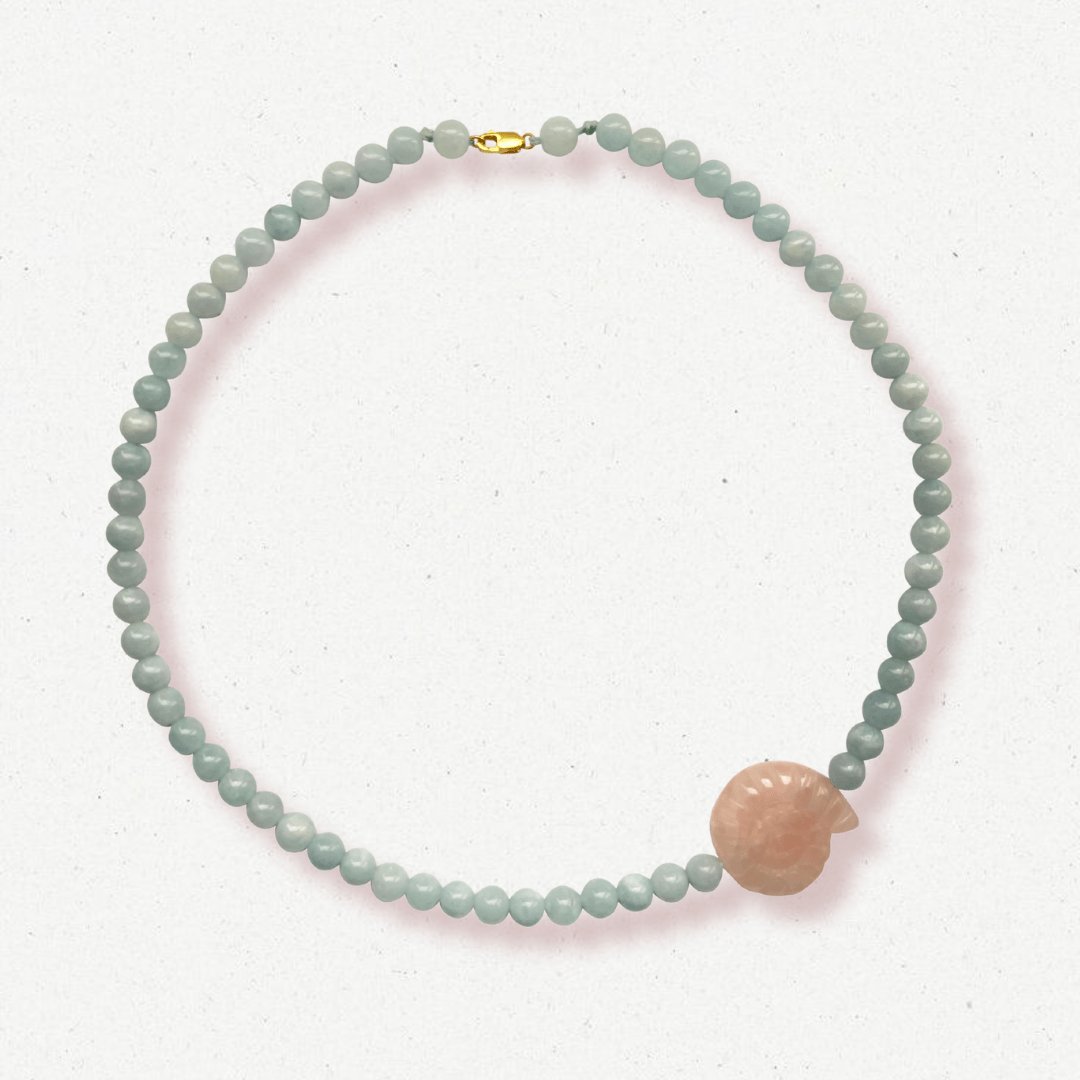 Beaded necklace with pink shell pendant close up