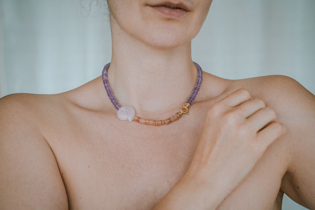 Woman wearing amethyst necklace