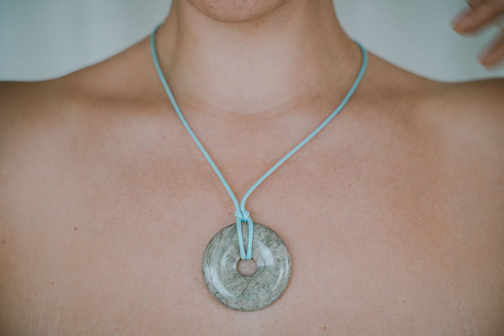 Woman wearing green agate necklace