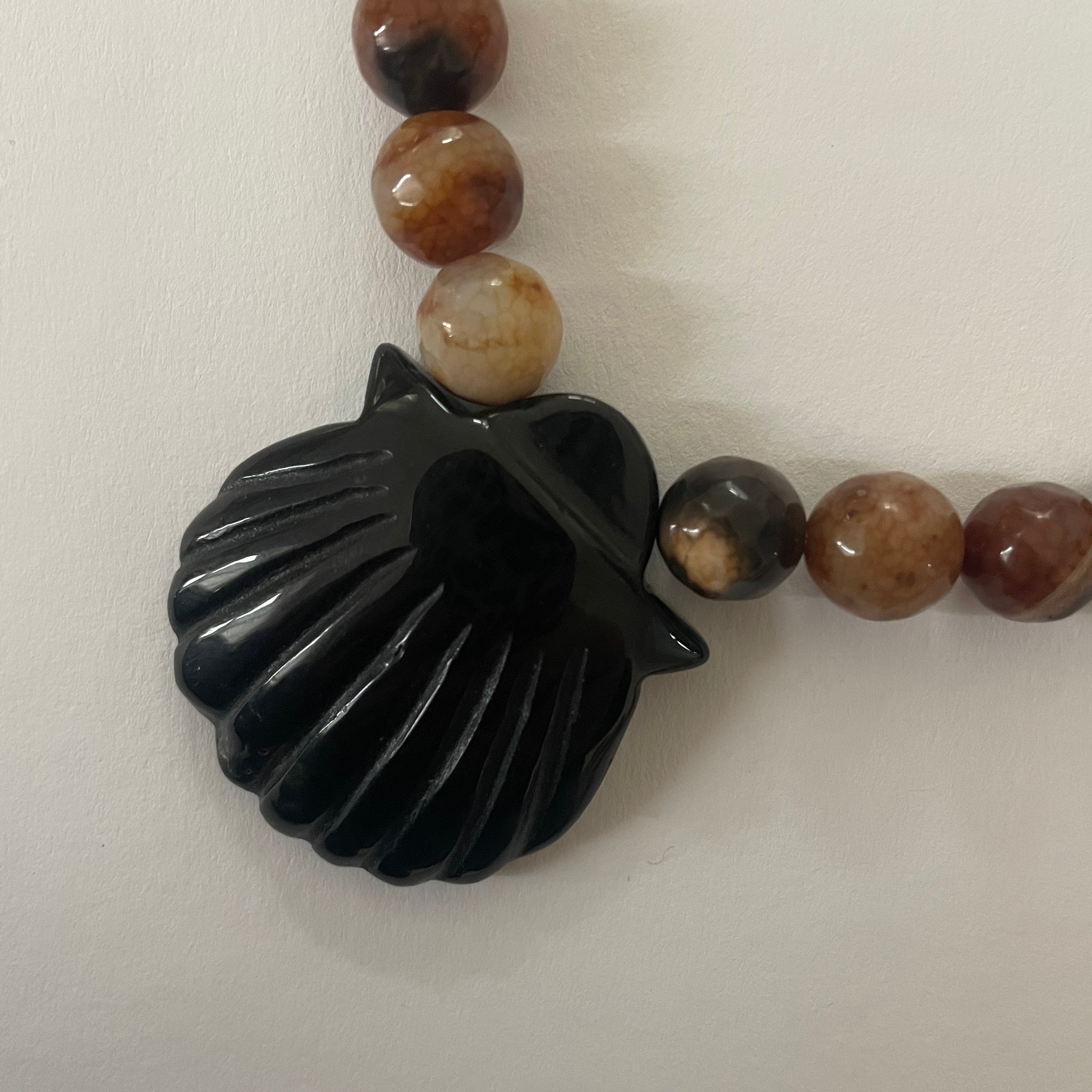 Brown and black gemstone protection necklace