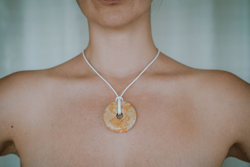 Woman wearing agate necklace minimal style