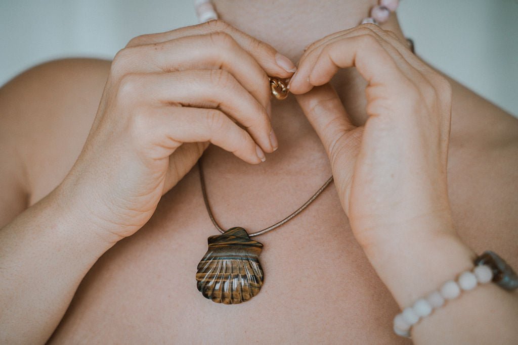 Woman wearing tiger’s eye necklace