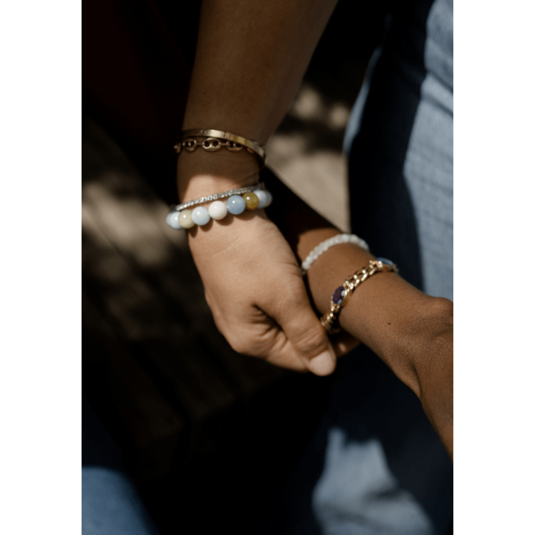Stacked bracelets with aquamarine stone minimal style
