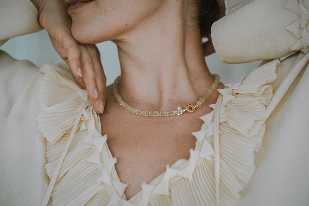 Woman wearing lemon quartz necklace