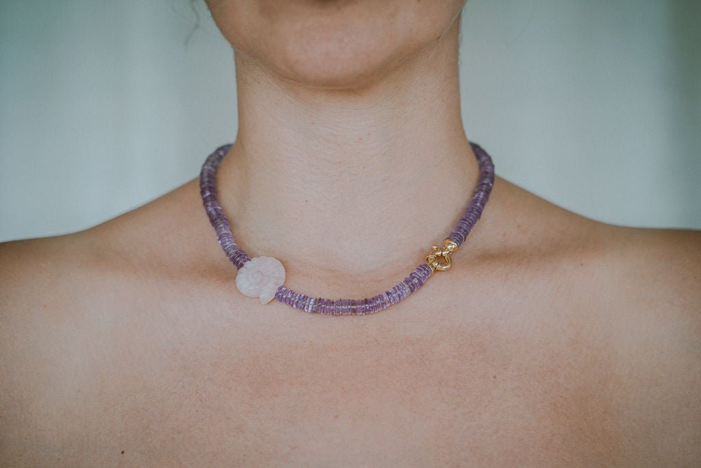 Woman wearing amethyst necklace